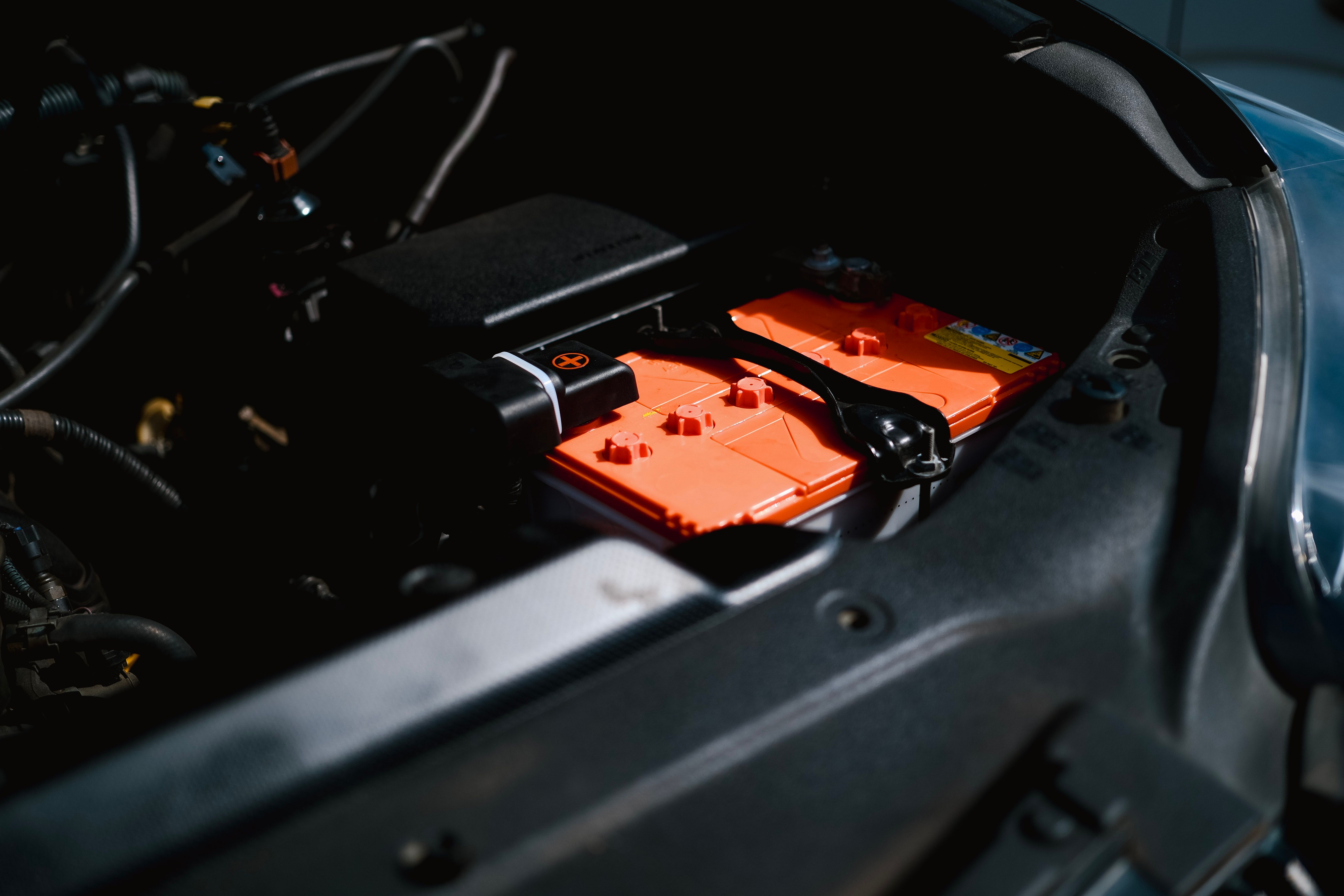 A high-voltage EV battery pack housing inside a vehicle's engine compartment